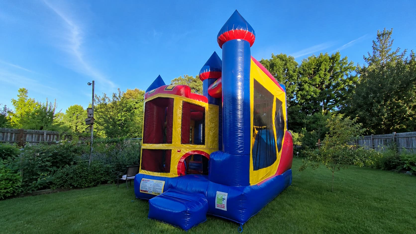 Backyard Castle Combo set up in a sunny backyard