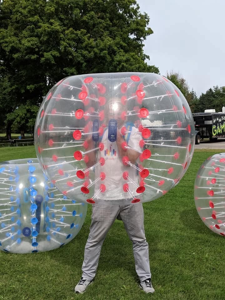 A player suited up inside a bumper bubble ball